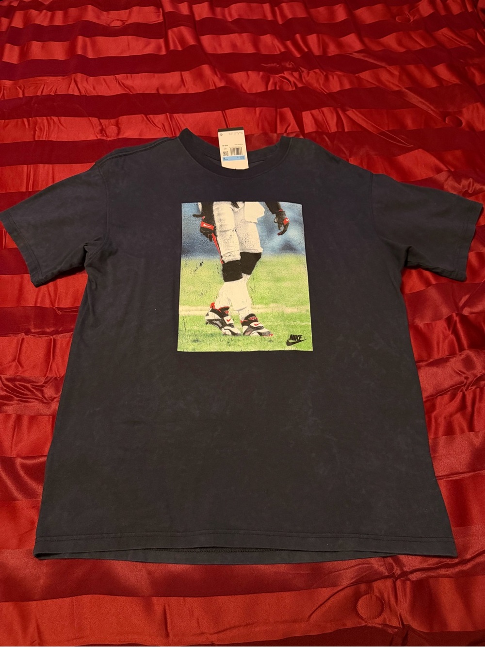 Nike washed black Graphic Football Player Tee with white and Green Print